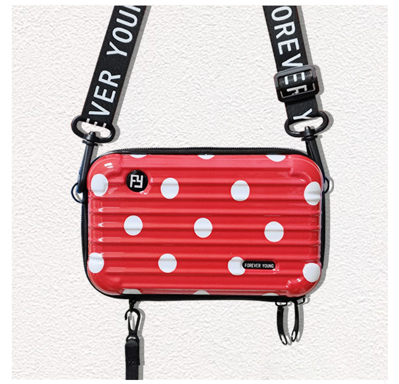 Mini-valise à bandoulière.