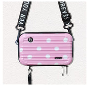 Mini-valise à bandoulière.