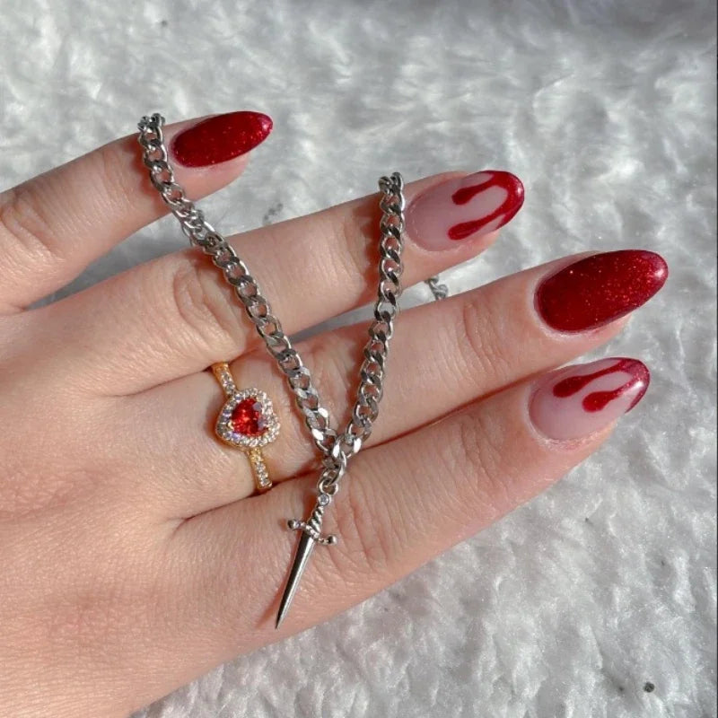 Ensemble bague cœur et bracelet épée