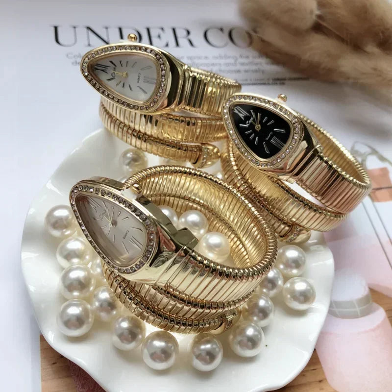 Montre à quartz serpentine pour femme.                            Serpentine Quartz Watch for Women