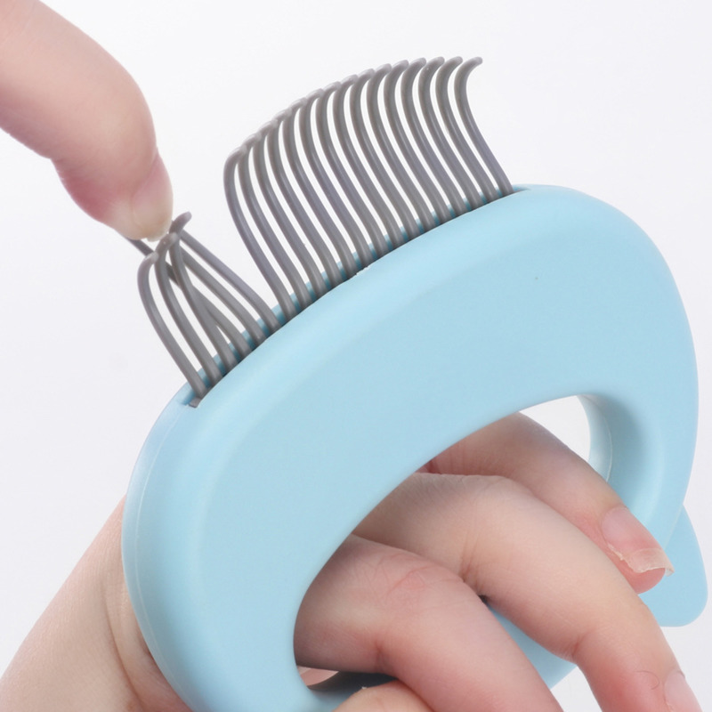 Peigne de toilettage et de massage pour chat