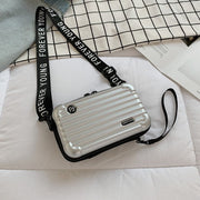 Mini-valise à bandoulière.