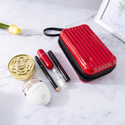 Mini-valise à bandoulière.