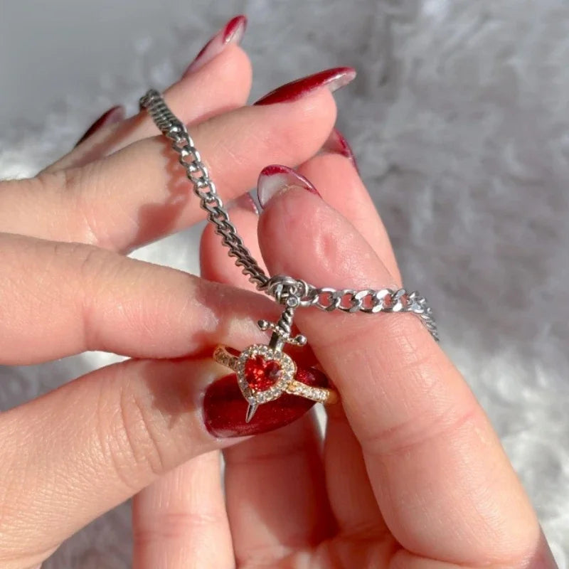Ensemble bague cœur et bracelet épée